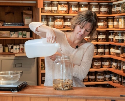 Little Dragon Medicinals. Kendra Starr making tinctures in her clinic.