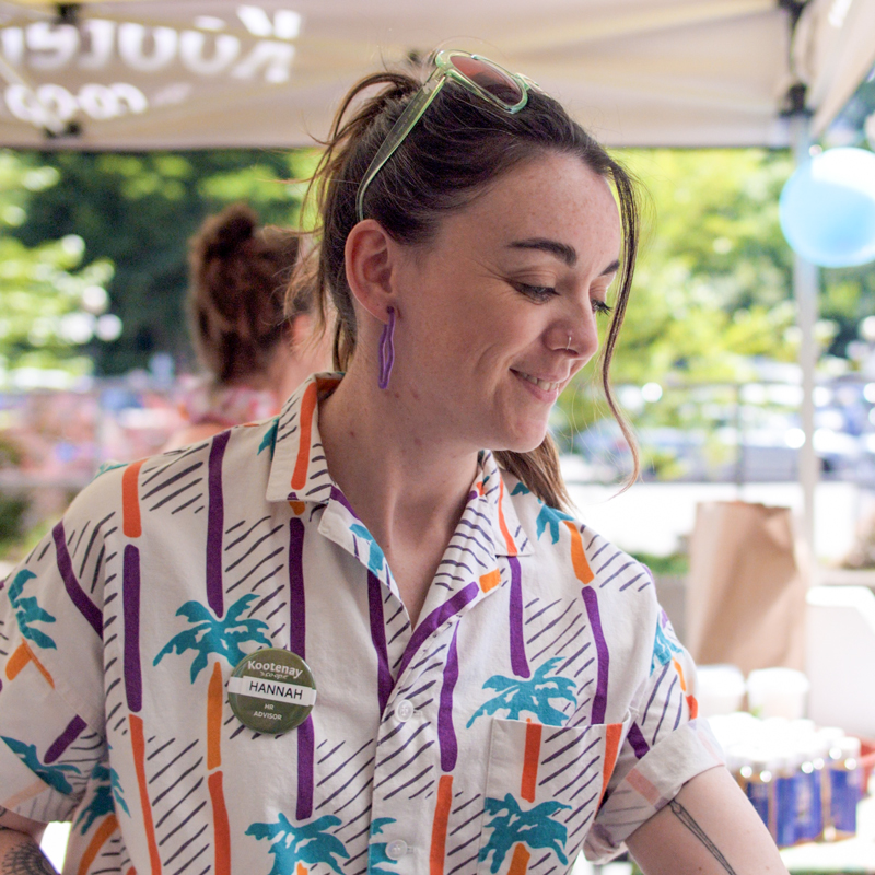Hannah serving cake at the Co-op Birthday party