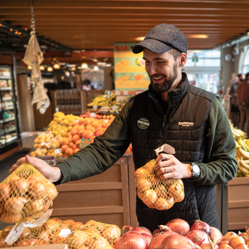 Sam stocking fresh produce
