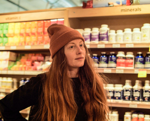 Brooke stocking shelves in the Wellness department