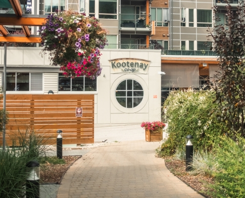 A view down the walking path towards the Kootenay Co-op in the summer time.